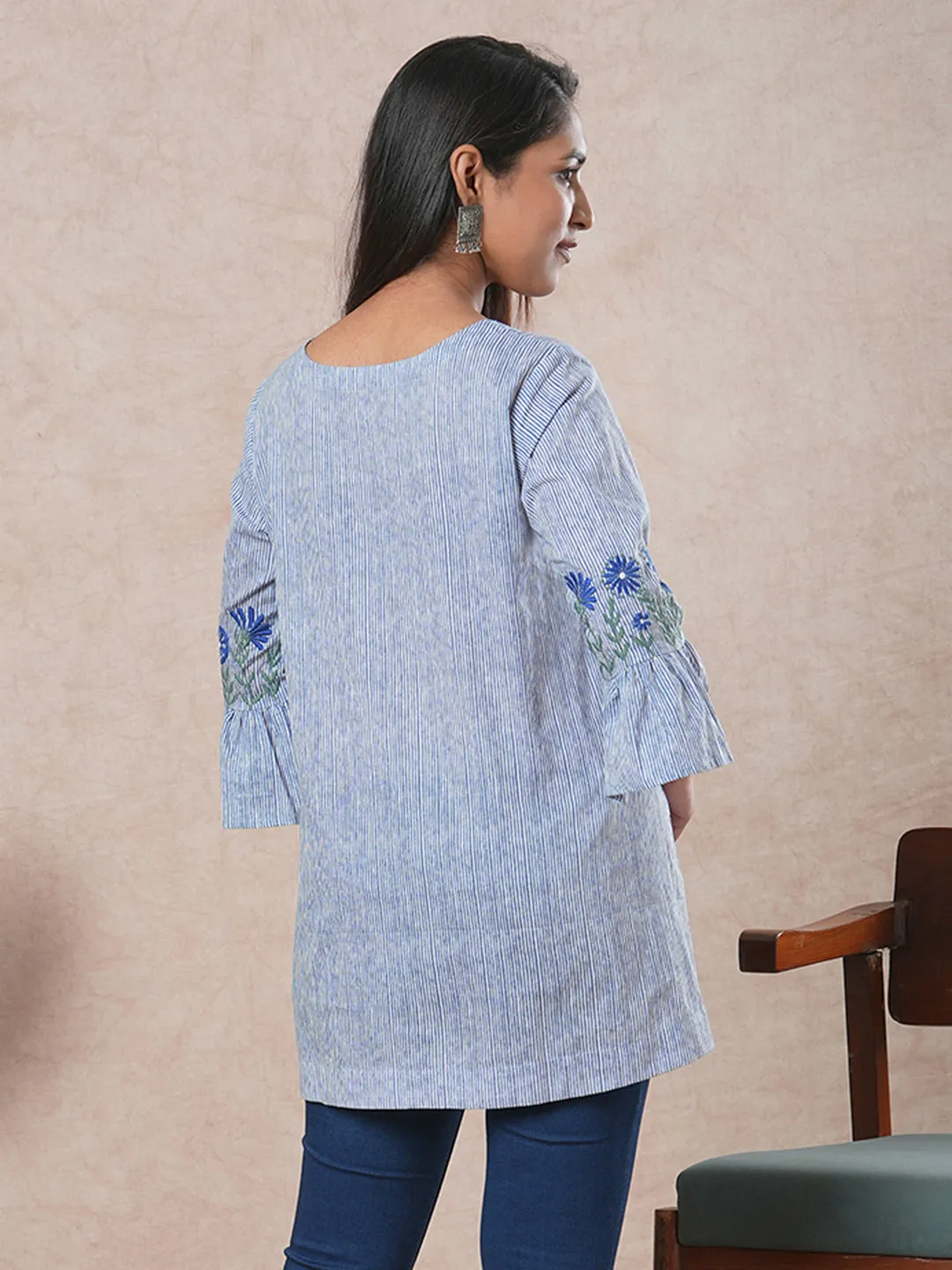 Flared printed cotton Tunic with machine embroidery on bell sleeve.