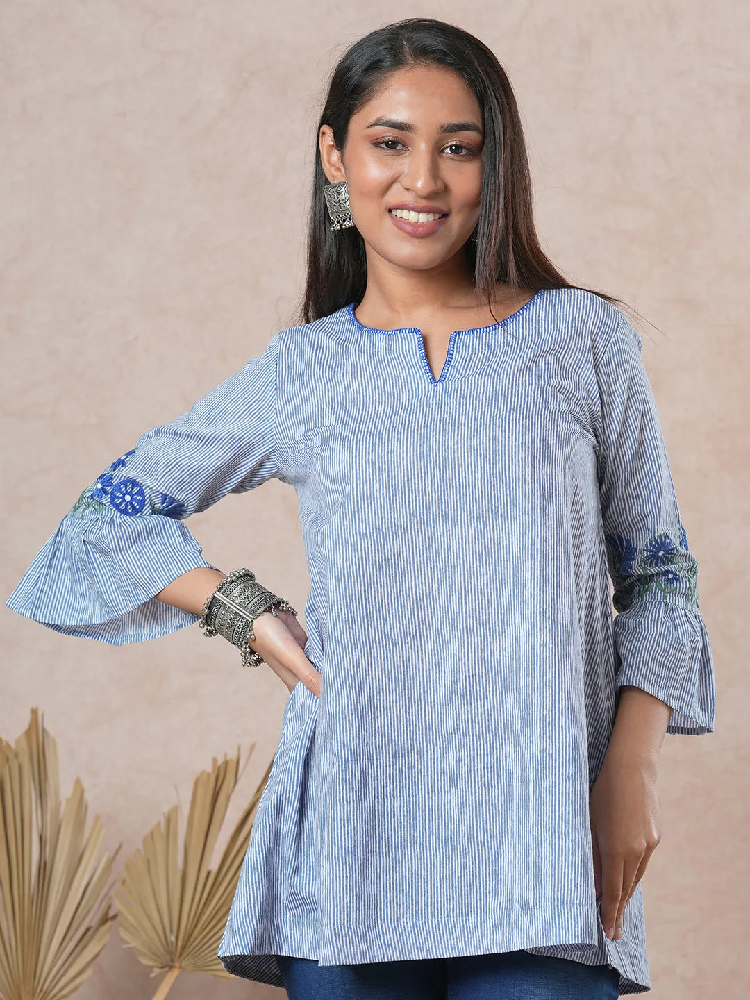 Flared printed cotton Tunic with machine embroidery on bell sleeve.